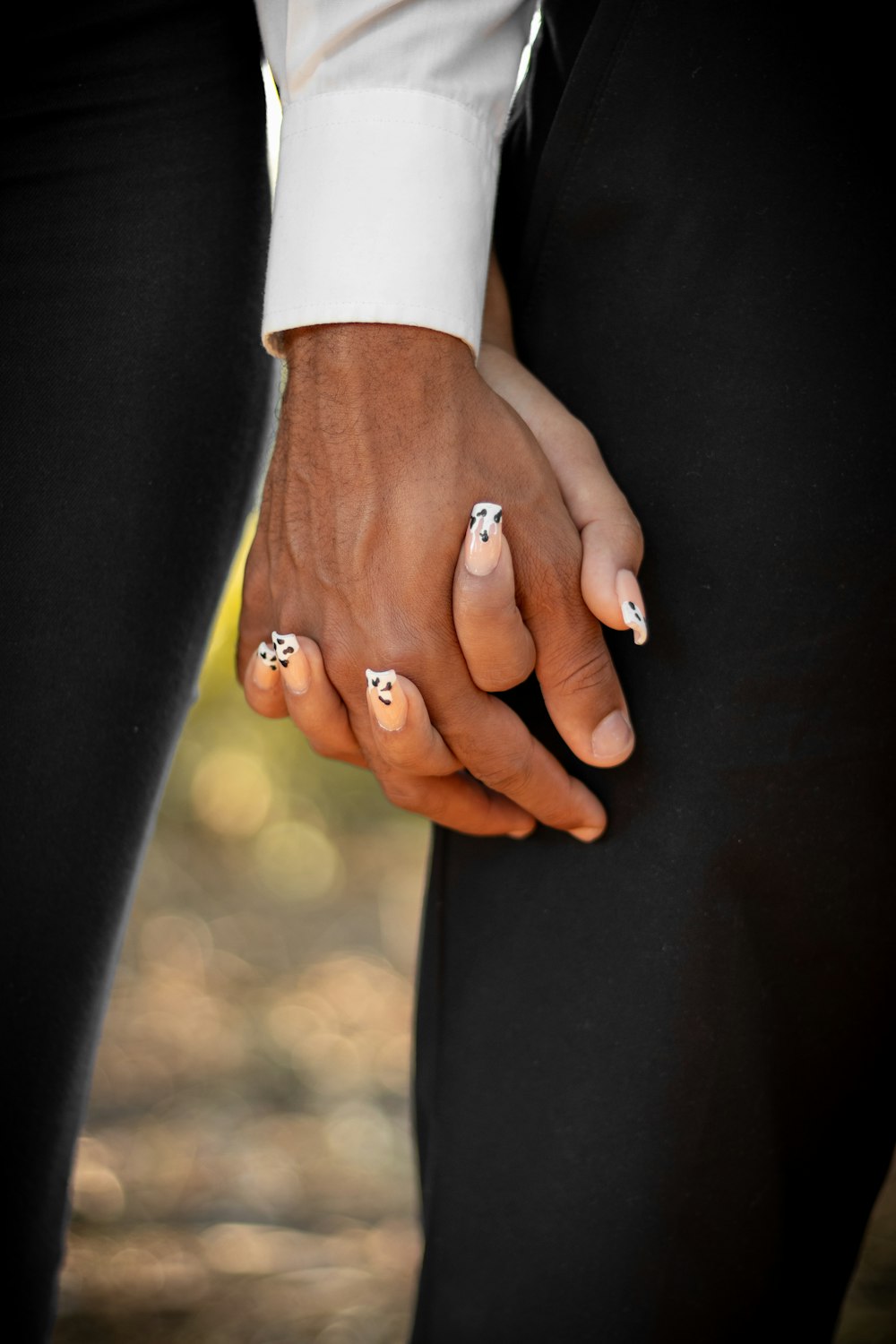 man and woman holding hands