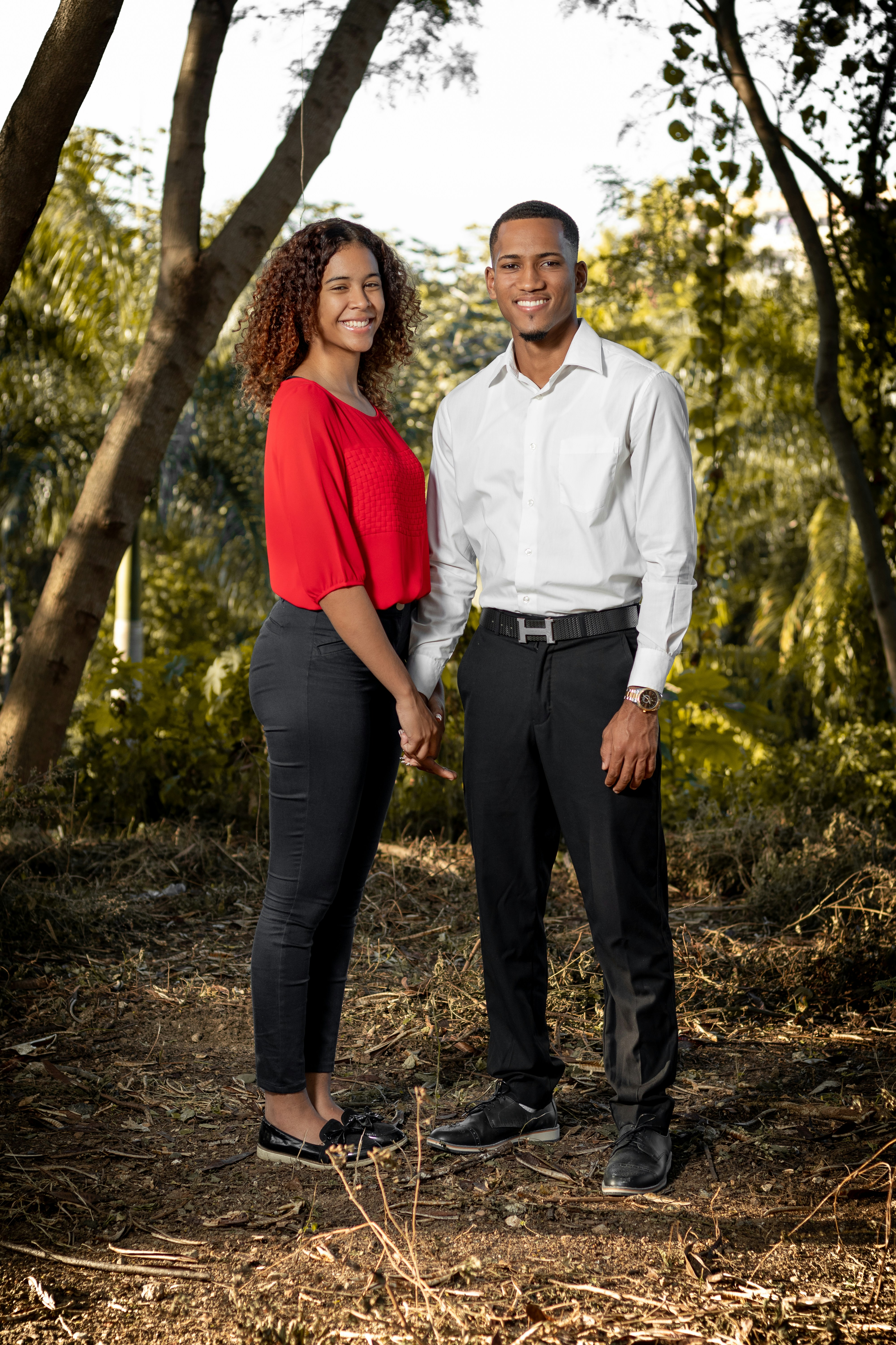man in white dress shirt and woman in red dress shirt