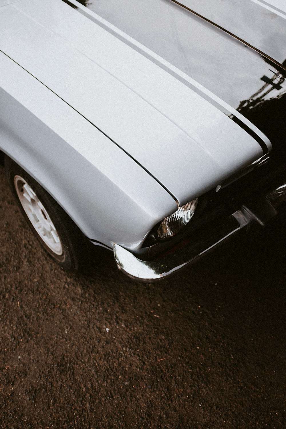 a silver car parked in a parking lot