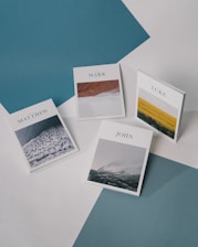 white and blue cards on blue textile