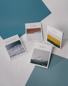 white and blue cards on blue textile