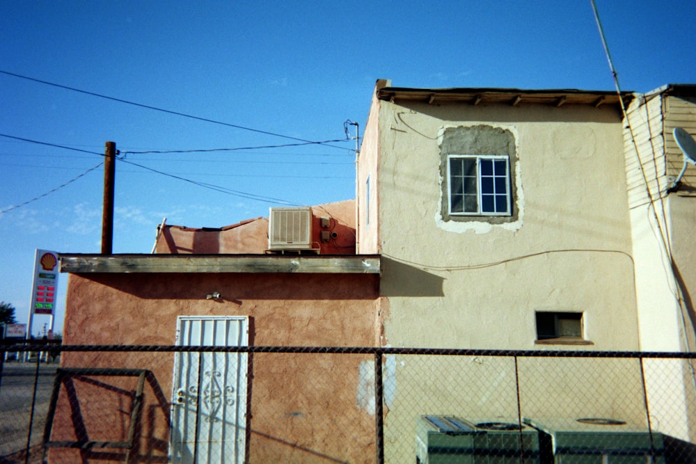 white and brown concrete building under blue sky during daytime