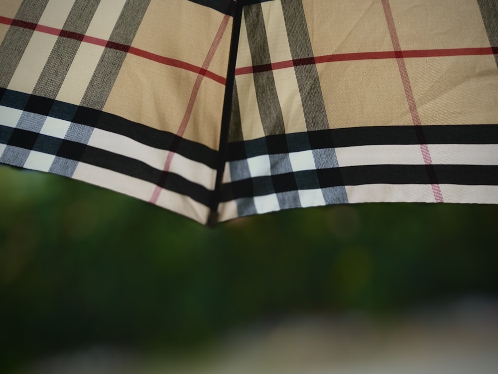 white red and black plaid umbrella