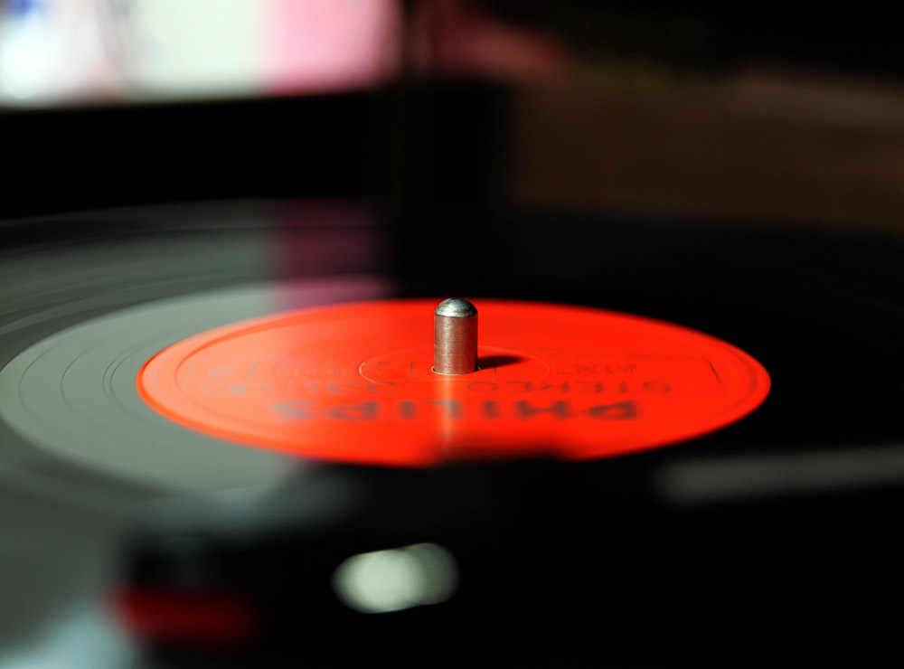 red vinyl record on black table