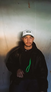 A close-up shot of a neon green crypto cartel hoodie draped over a sleek black chair under moody lighting.