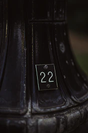 A close-up of a limited edition art piece with a visible unique serial number tag