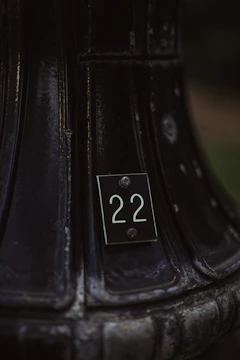 A close-up of a limited edition art piece with a visible unique serial number tag