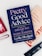 A hardcover book titled 'Pretty Good Advice' is lying on top of another book. The book cover is dark blue with pink and white text, featuring motivational phrases. Around the books are blurred objects, possibly cosmetics or personal care items, placed on a white surface.