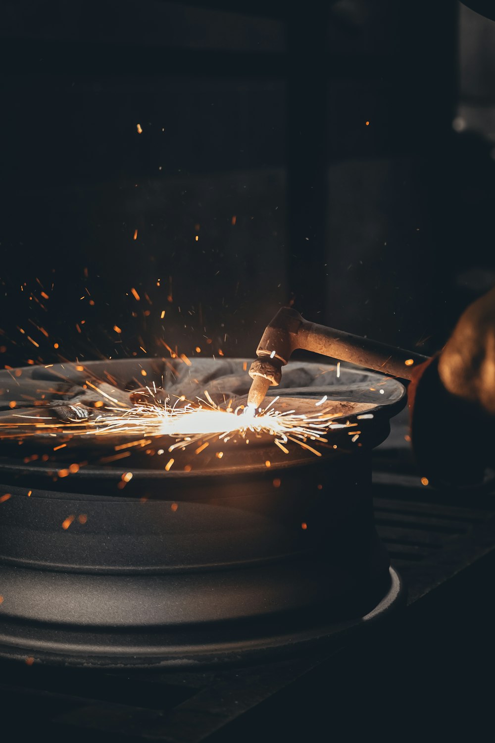 person holding a stick with fire