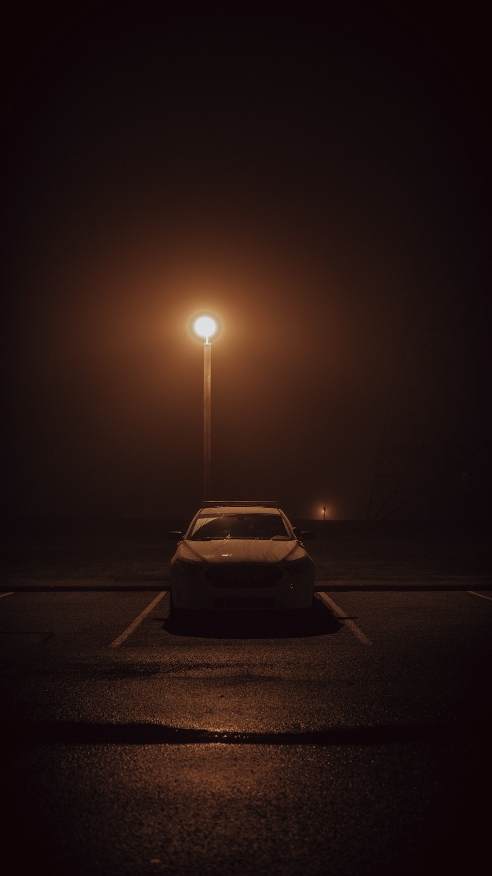 white car on road during night time