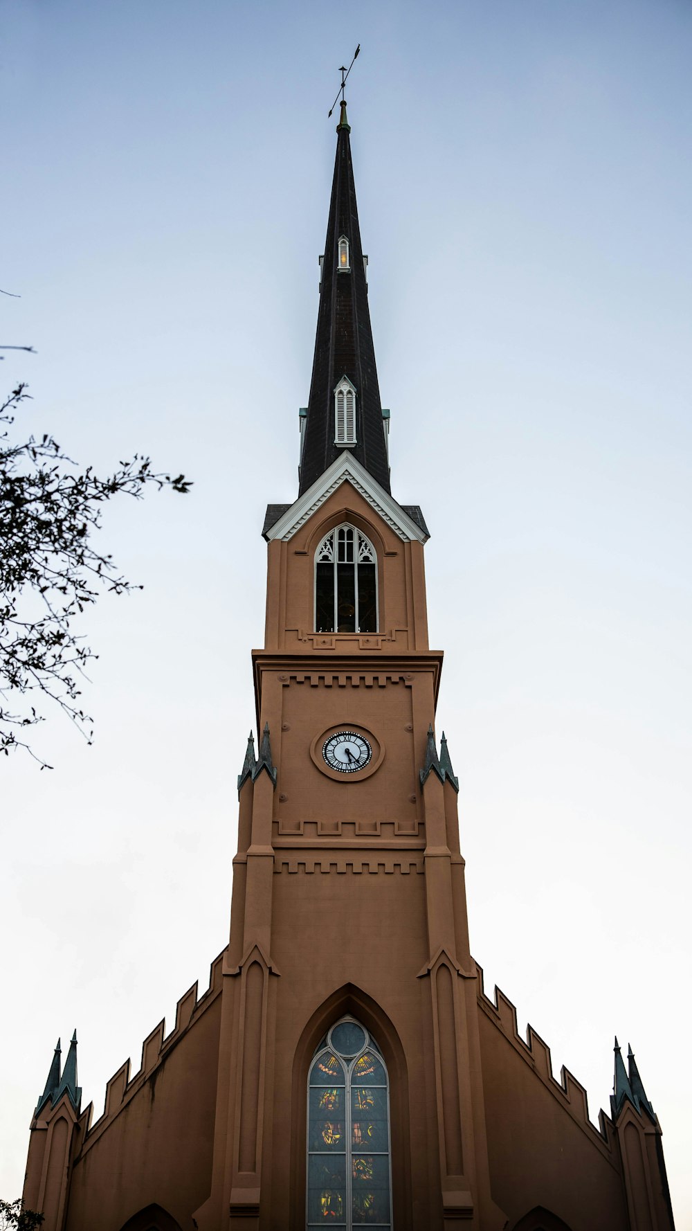 a church steeple with a clock on it