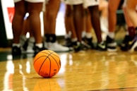 orange basketball on brown wooden floor