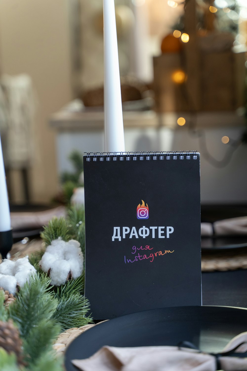 a table setting with a notebook and candles