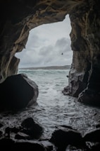 brown rock formation on sea during daytime