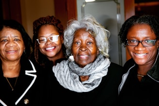 woman in black shirt beside woman in gray scarf