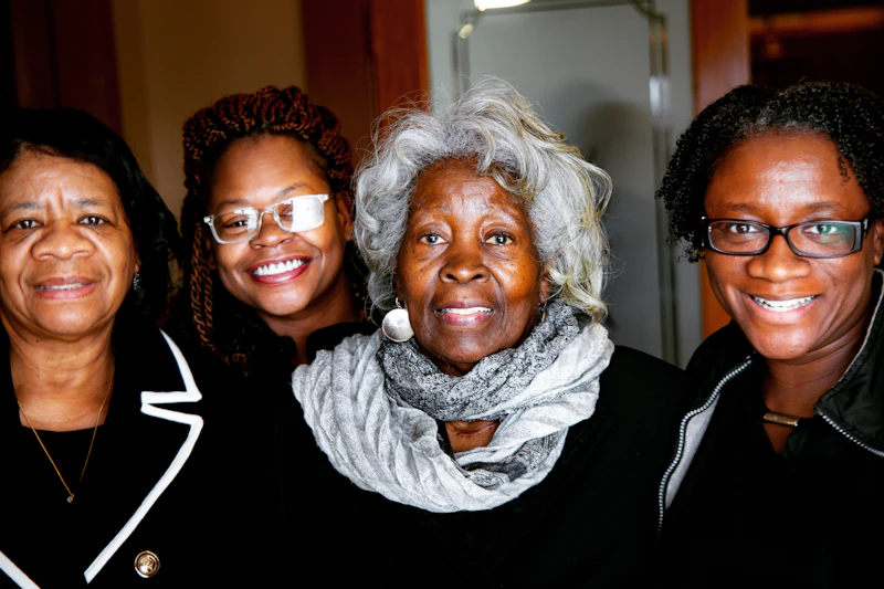 Three generations of women smiling together