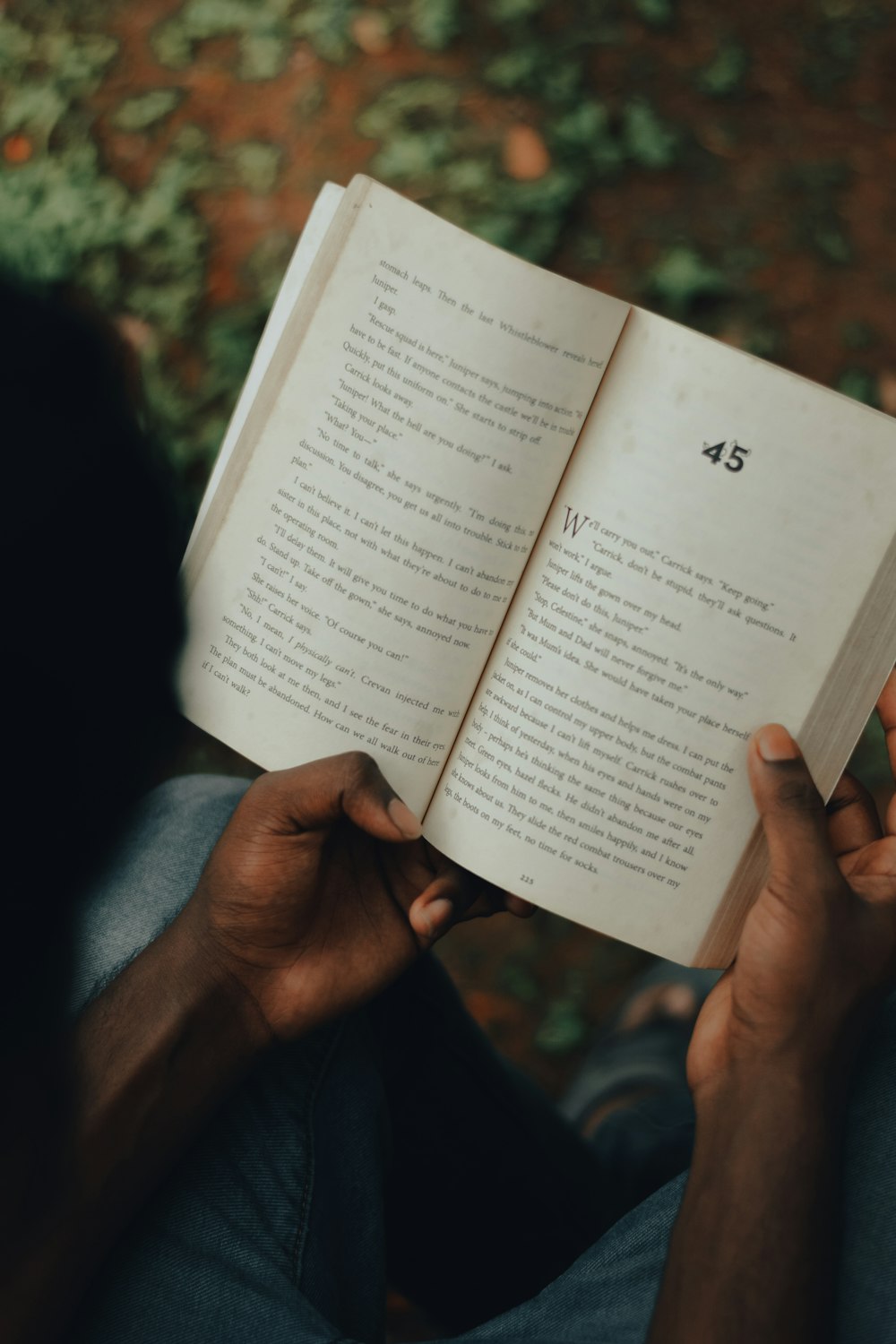 person holding white book page