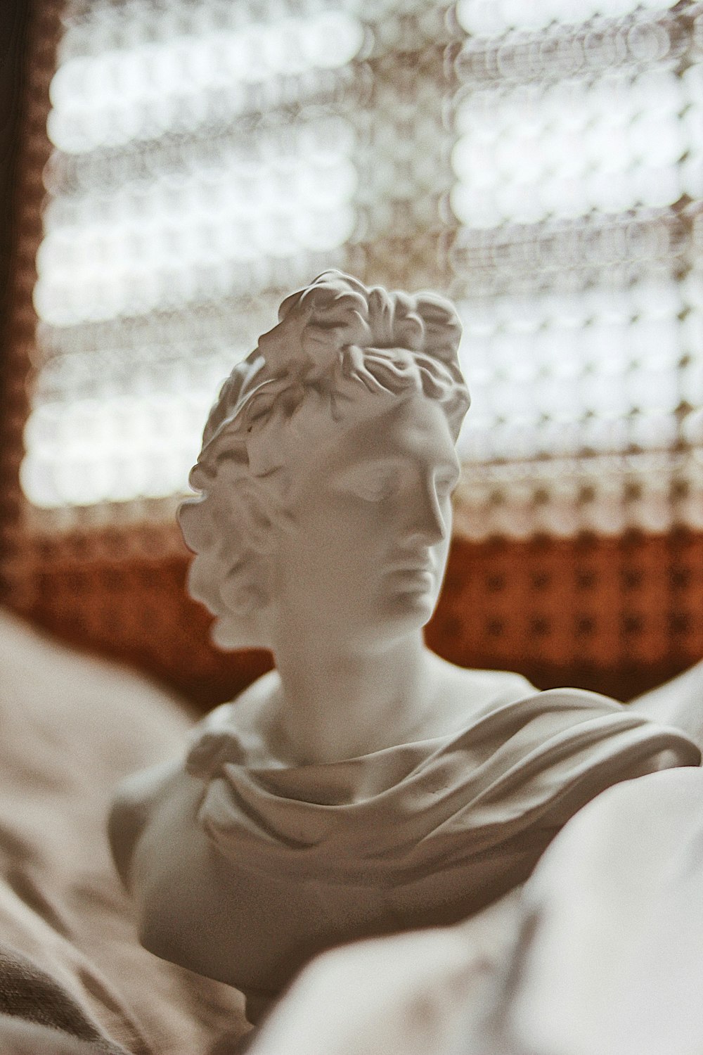 woman in white tank top statue