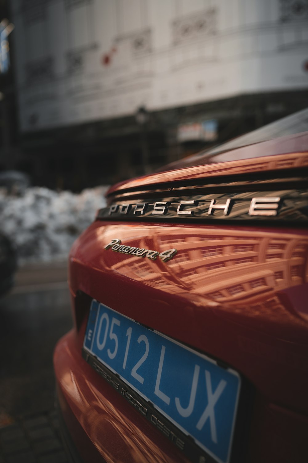 red and black car on road