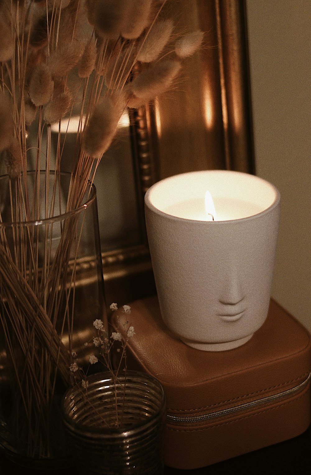 white candle on brown wooden table