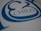 A close-up view of stylized blue text on a white surface, featuring the word 'CHILD' with decorative elements surrounding it.