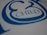 A close-up view of stylized blue text on a white surface, featuring the word 'CHILD' with decorative elements surrounding it.