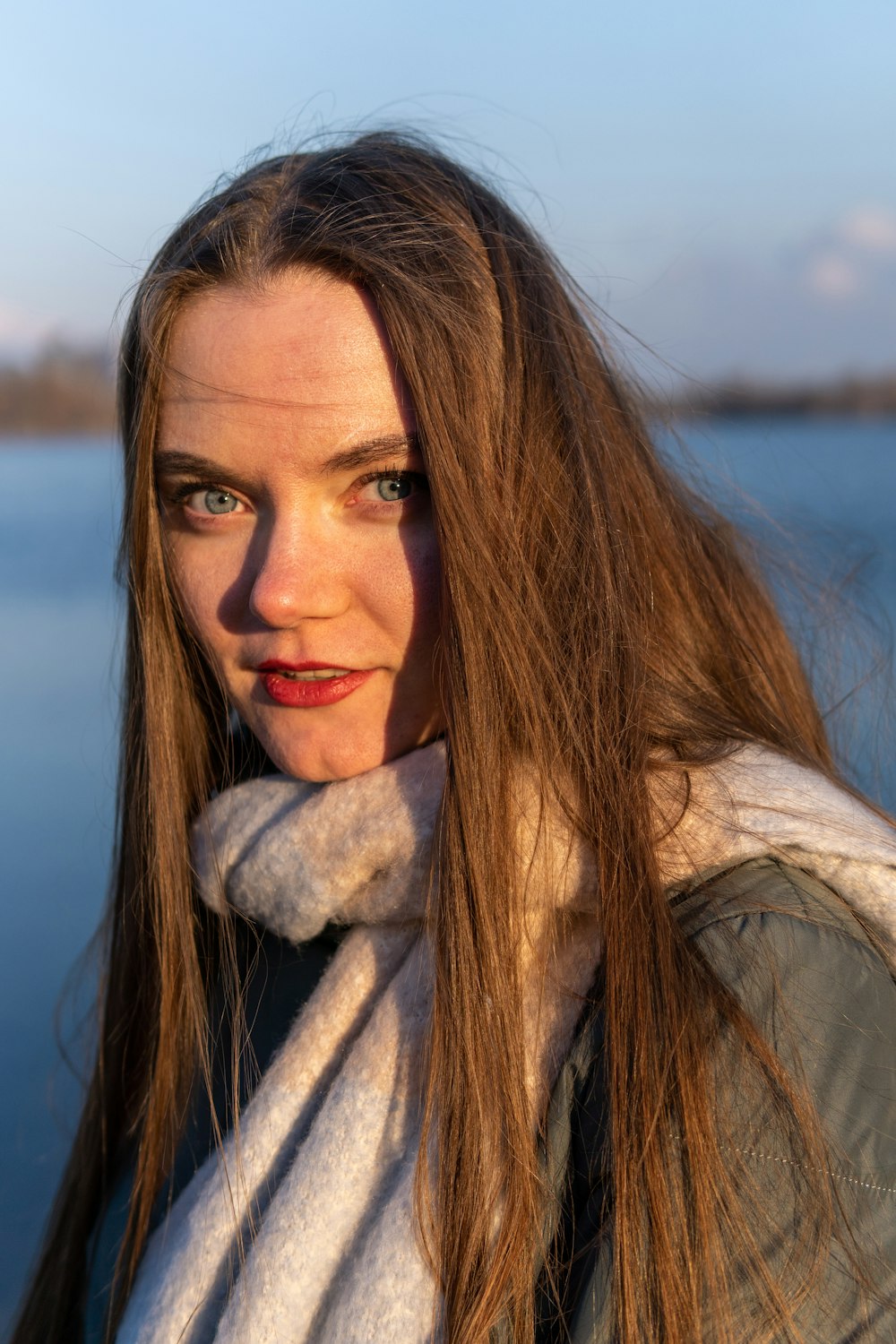 woman in white and brown scarf