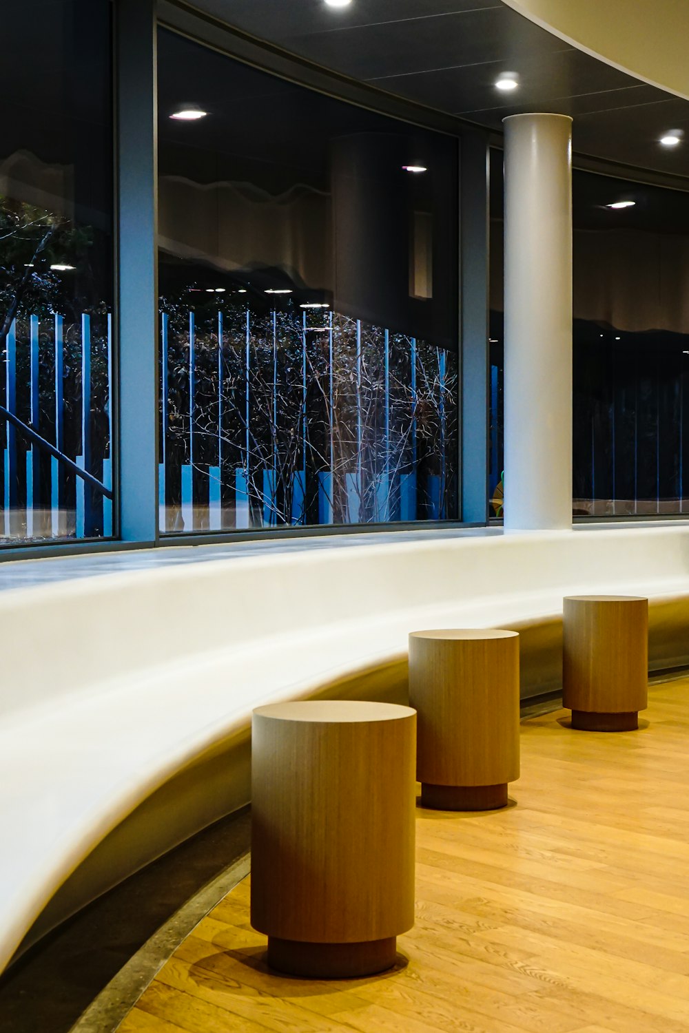 brown wooden chairs on white floor tiles