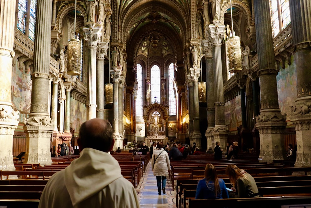 people sitting on chair inside church