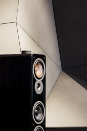 black and silver speaker on white ceramic tiles