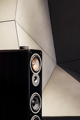 black and silver speaker on white ceramic tiles