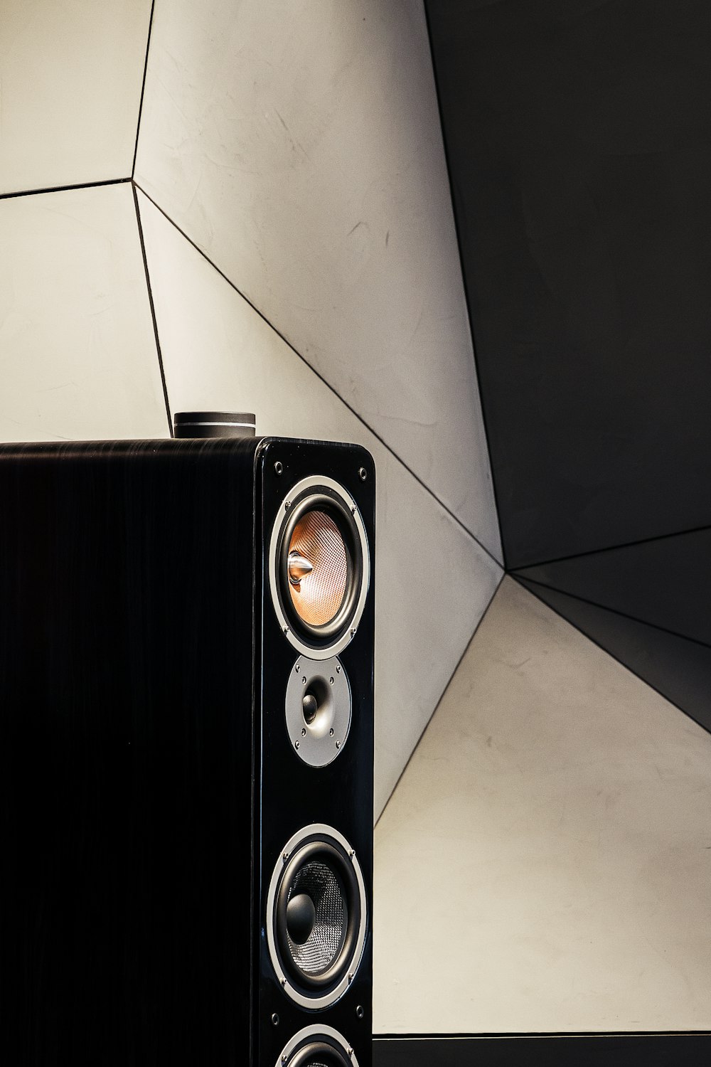 black and silver speaker on white ceramic tiles