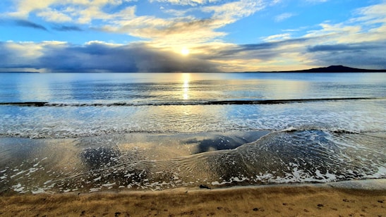 Beautiful beach sunset in Bali with clear skies and calm waves