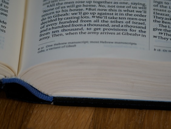 An open book with visible text, focusing on a specific section of printed content. The book is placed on a flat surface with a hardcover edge slightly elevated.