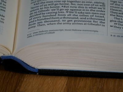 An open book with visible text, focusing on a specific section of printed content. The book is placed on a flat surface with a hardcover edge slightly elevated.