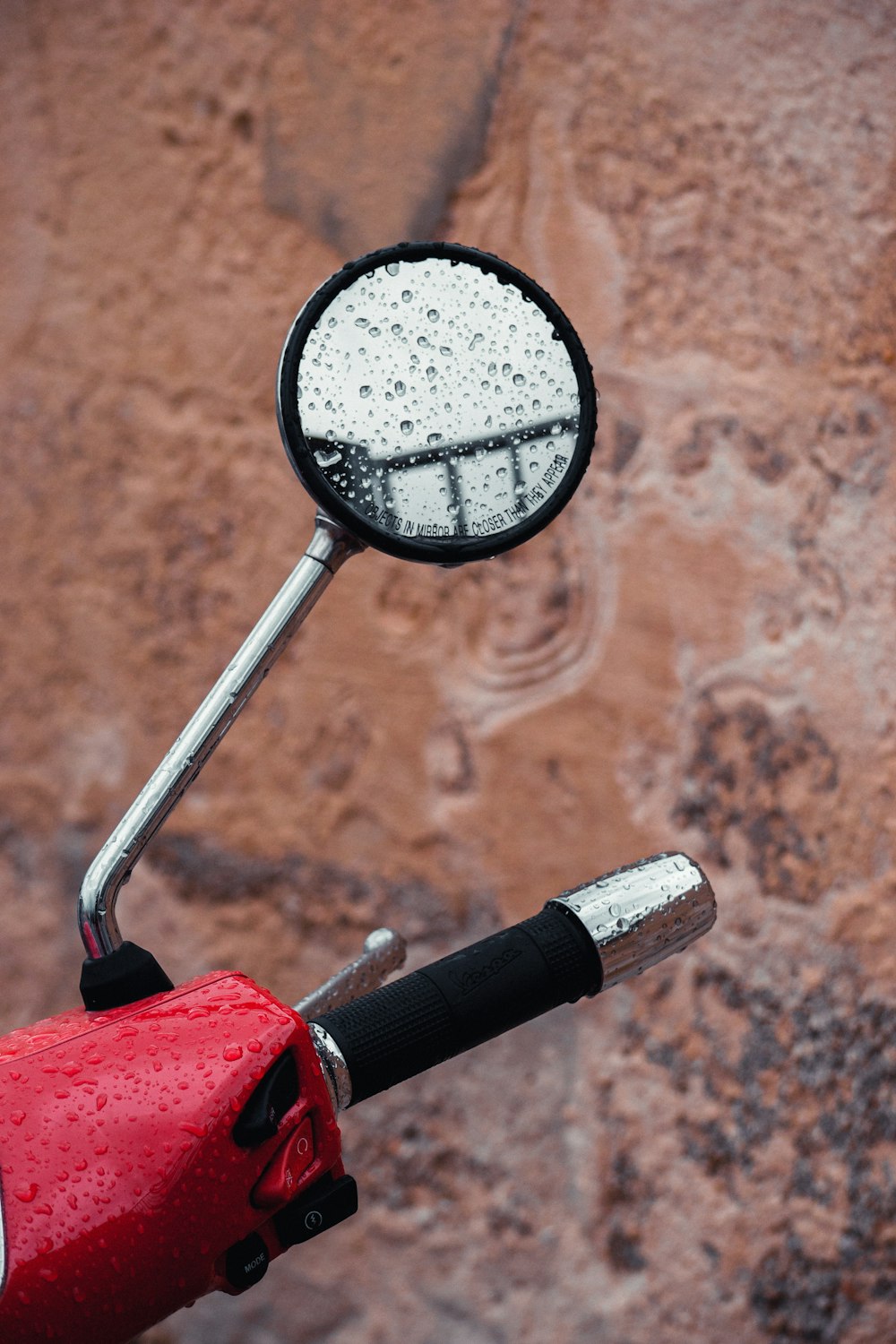 black magnifying glass on red and black wooden table