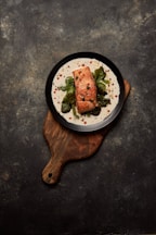 brown wooden round plate with food
