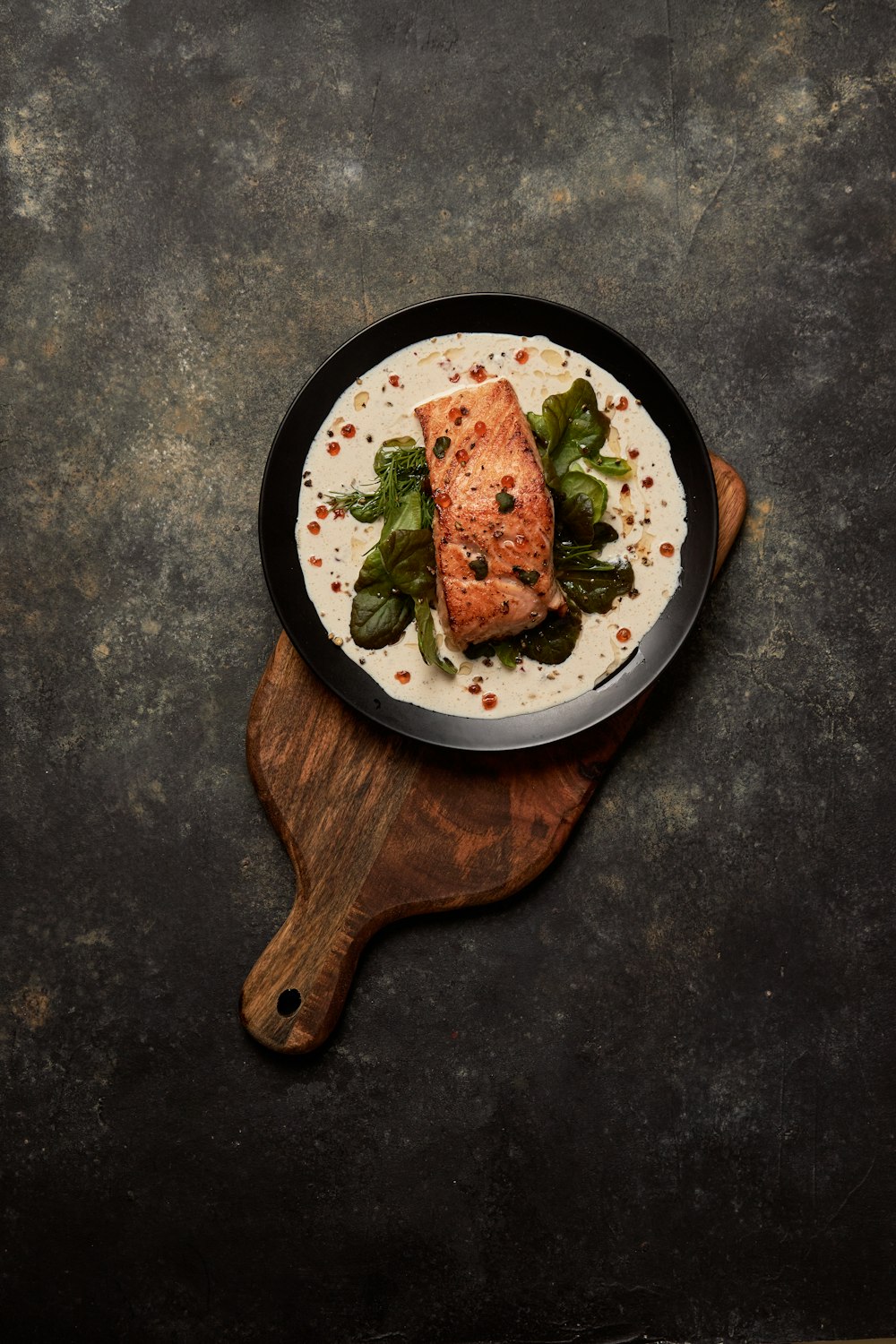 brown wooden round plate with food