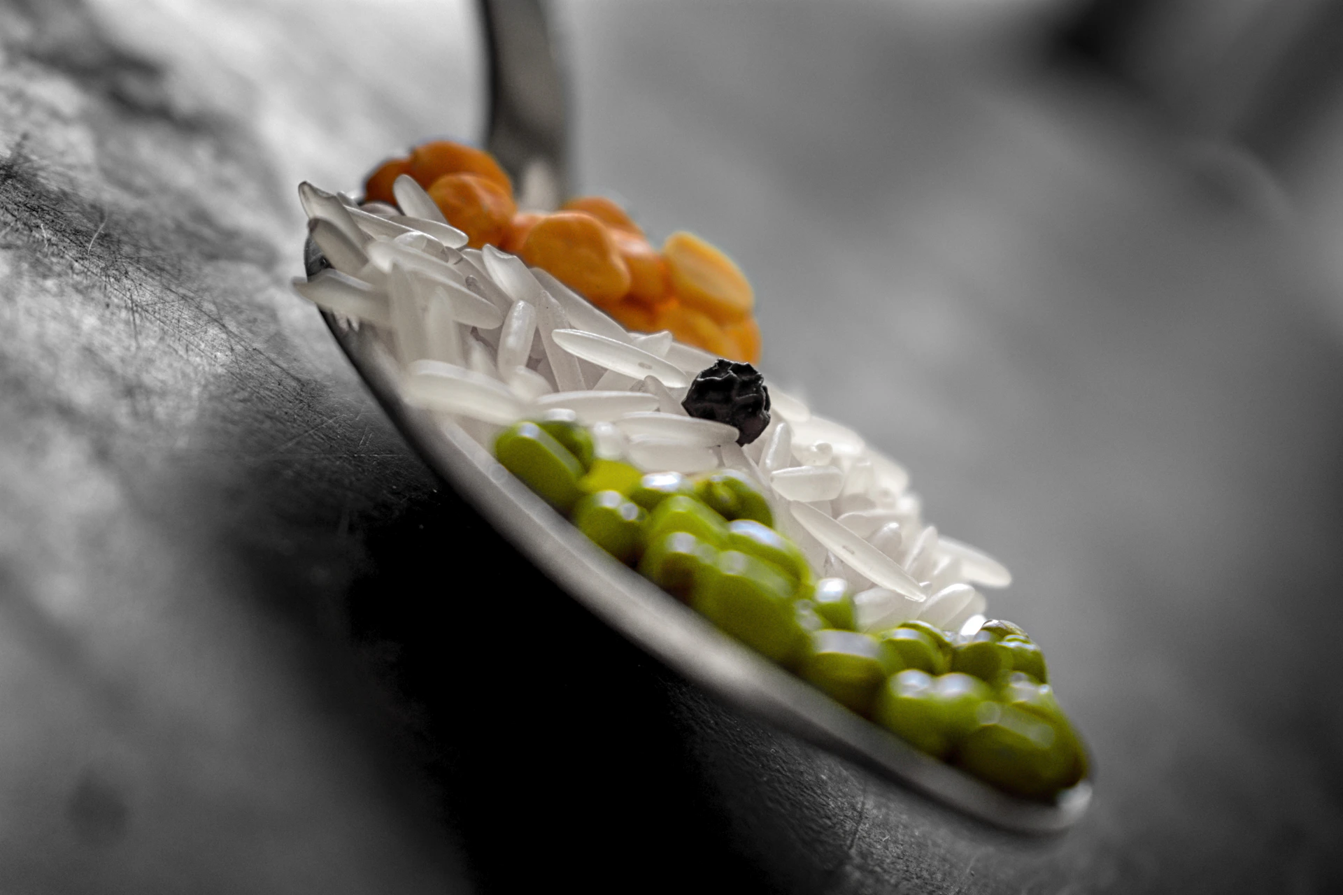 A close-up photo of a colorful bowl of organic baby rice booster with fresh ingredients around it, highlighting natural textures.