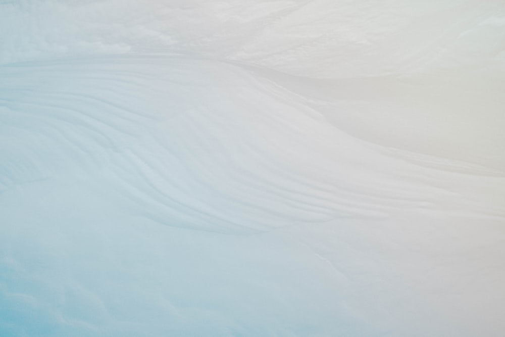 white sand under blue sky during daytime