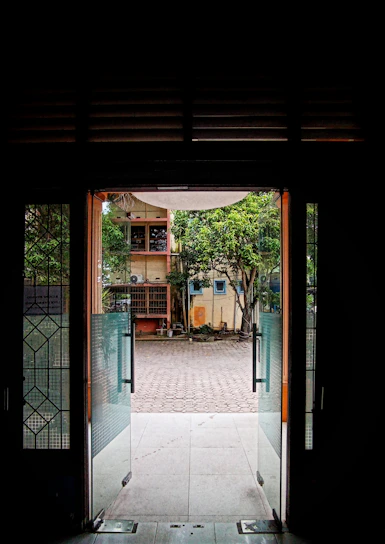 Balcony view of the green inner courtyard from the Garden Suite.