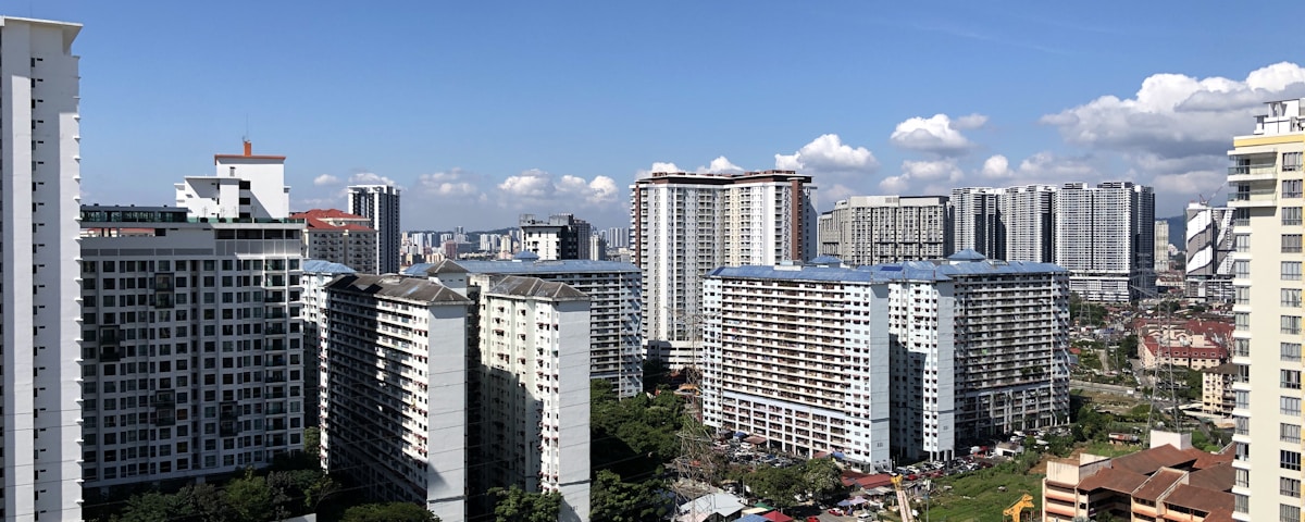 white and gray concrete buildings under blue sky during daytime