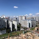 white and gray concrete buildings under blue sky during daytime