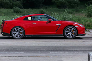 red ferrari 458 italia on road during daytime
