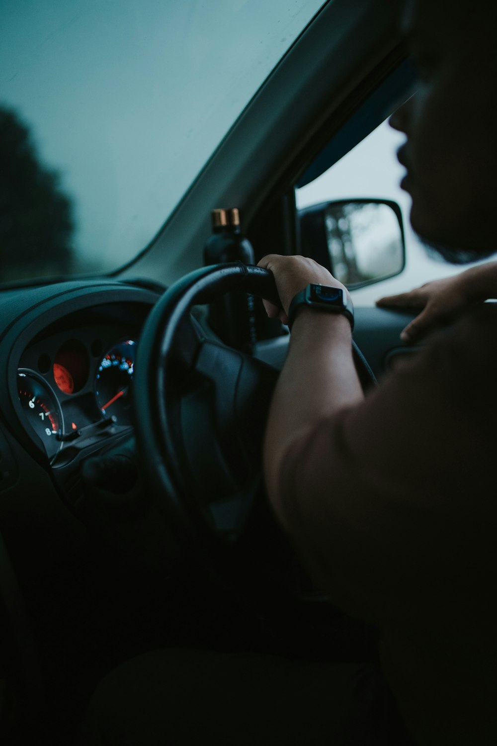 person driving car during daytime