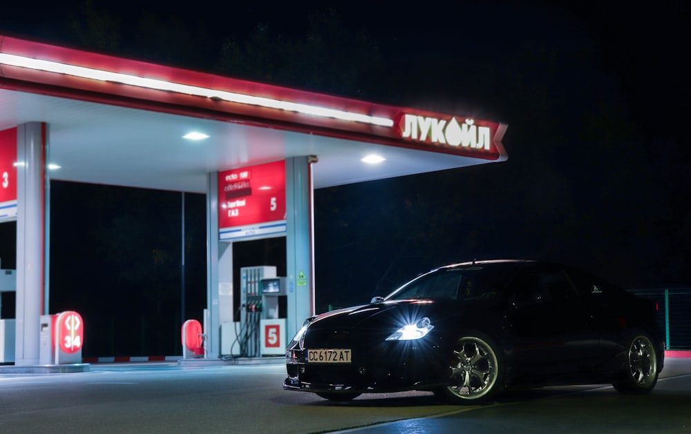 black car parked in front of store