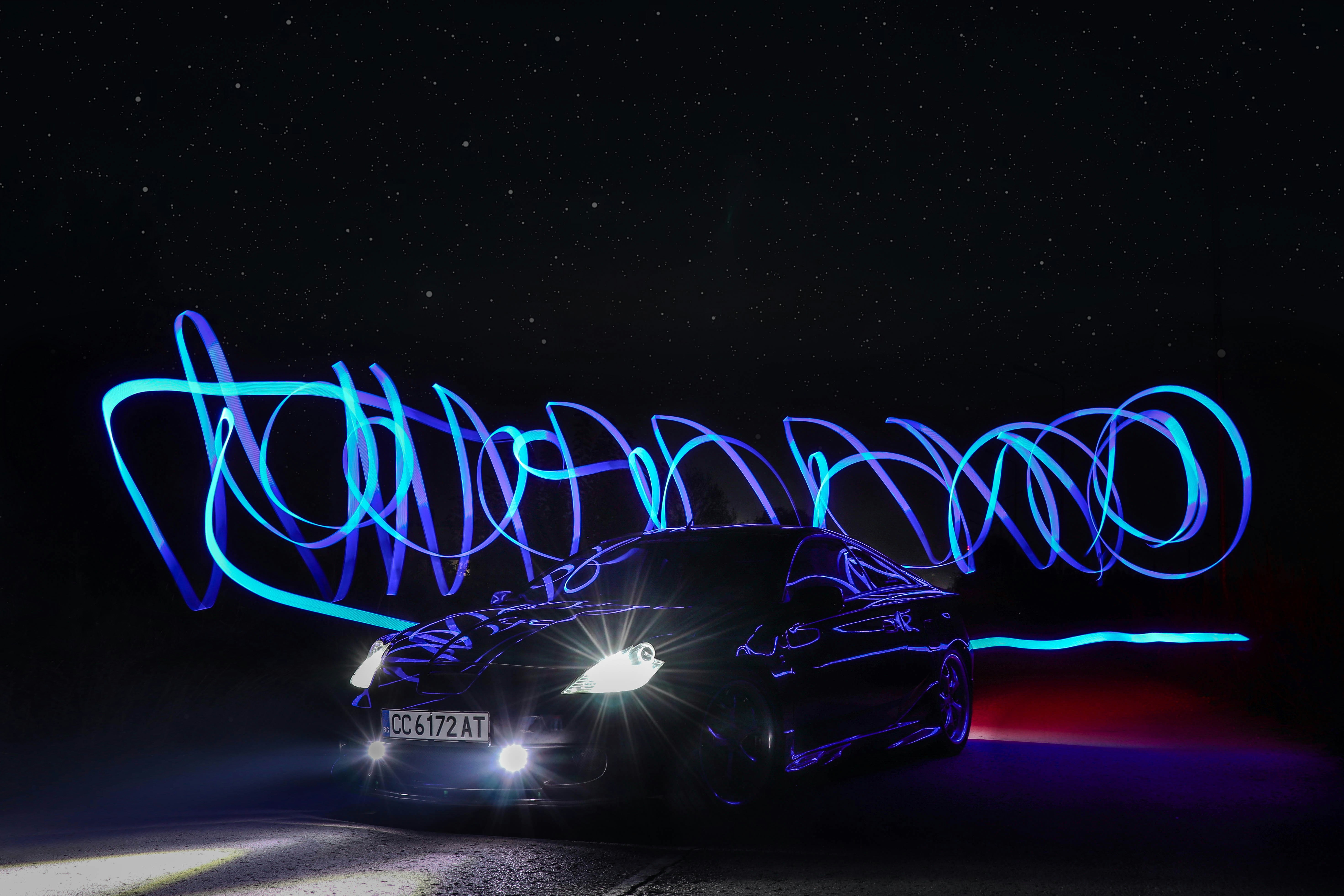 Ford F-150 Lightning electric pickup truck plugged into a charging station