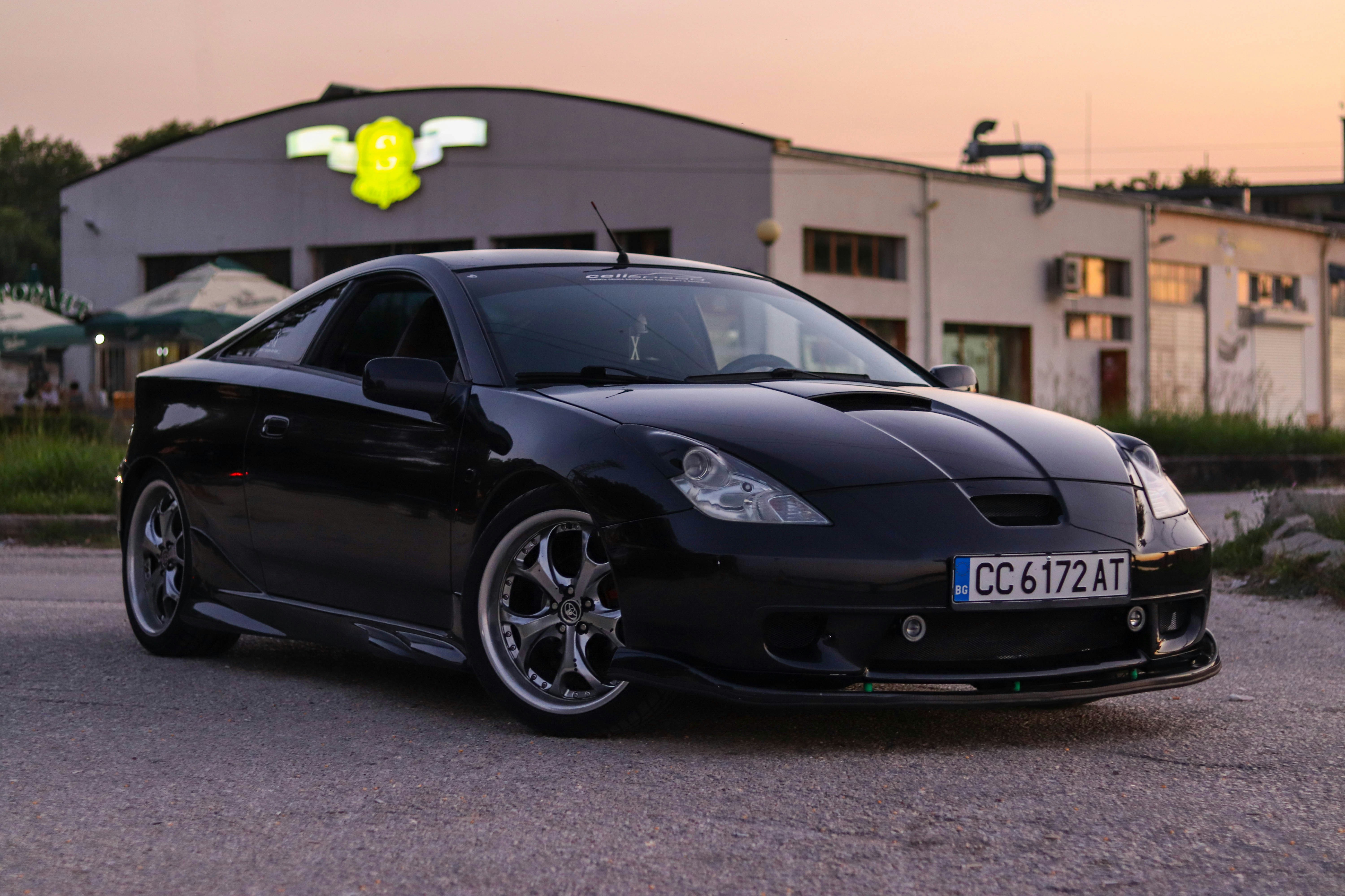 black bmw m 3 coupe parked on gray asphalt road during daytime