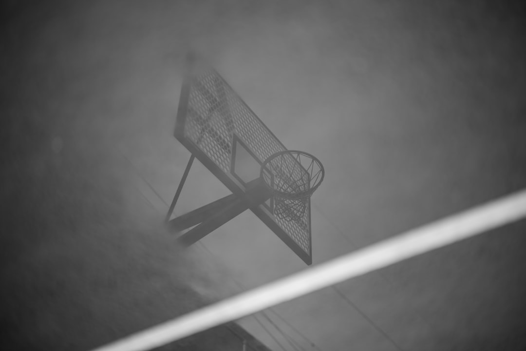 grayscale photo of basketball hoop