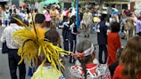 A vibrant street scene featuring diverse individuals in artistic outfits.